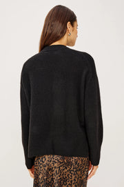 back view of woman wearing a black cashmere blend sweater