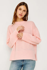 woman wearing a pink cash-blend sweater