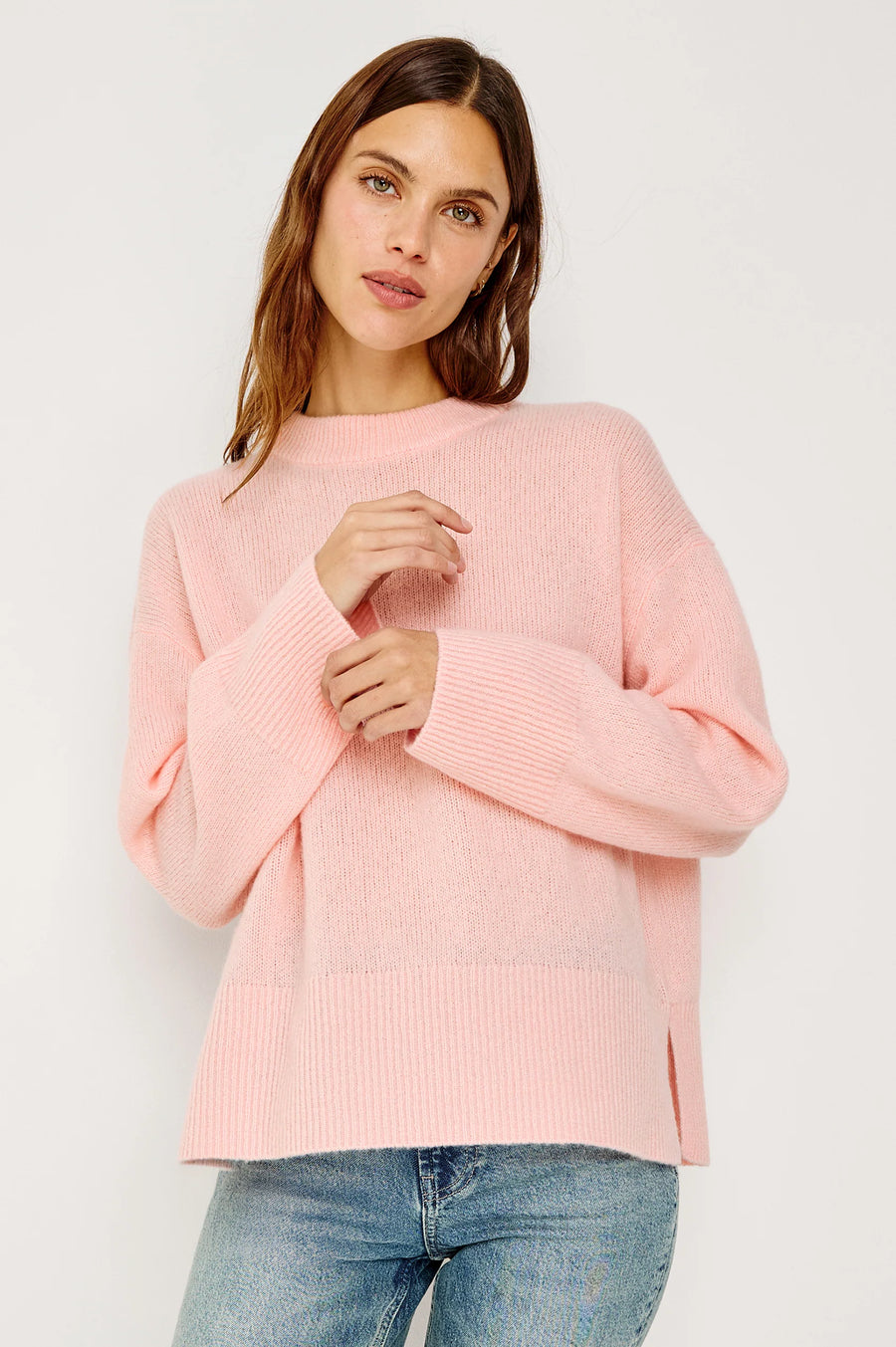 woman wearing a pink cash-blend sweater