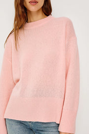 close-up woman wearing a pink cash-blend sweater