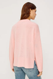 woman wearing a pink cash-blend sweater