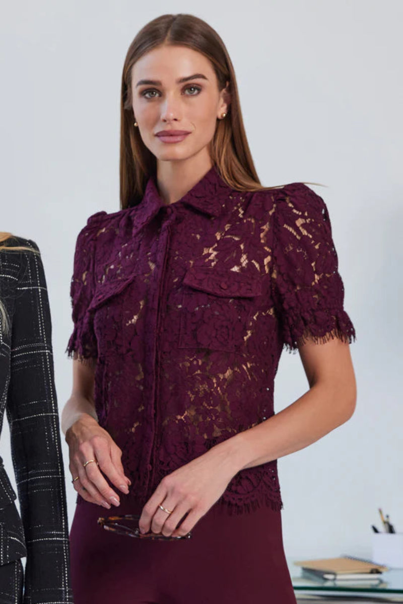 Front view of woman wearing a button down short sleeve lace blouse