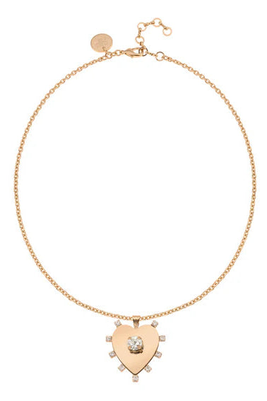 Gold necklace with a heart-shaped pendant on a white background