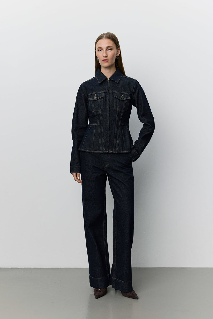 Women wearing dark denim peplem jacket 