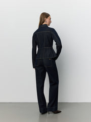Women wearing dark denim peplem jacket 