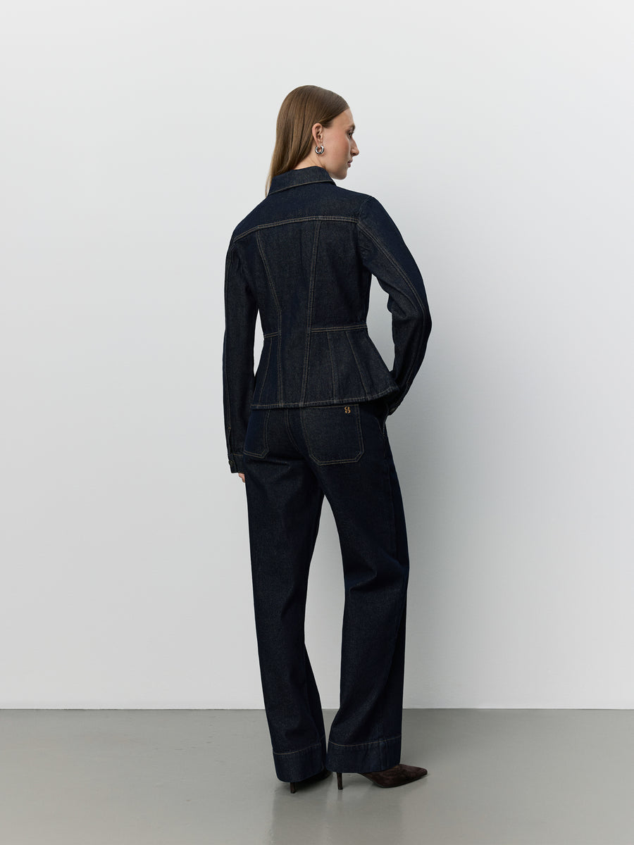 Women wearing dark denim peplem jacket 