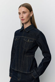 Women wearing dark denim peplem jacket 