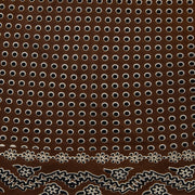 A brown square scarf with a white and gray paisley bandana pattern, styled in a loose knot on a solid white background.