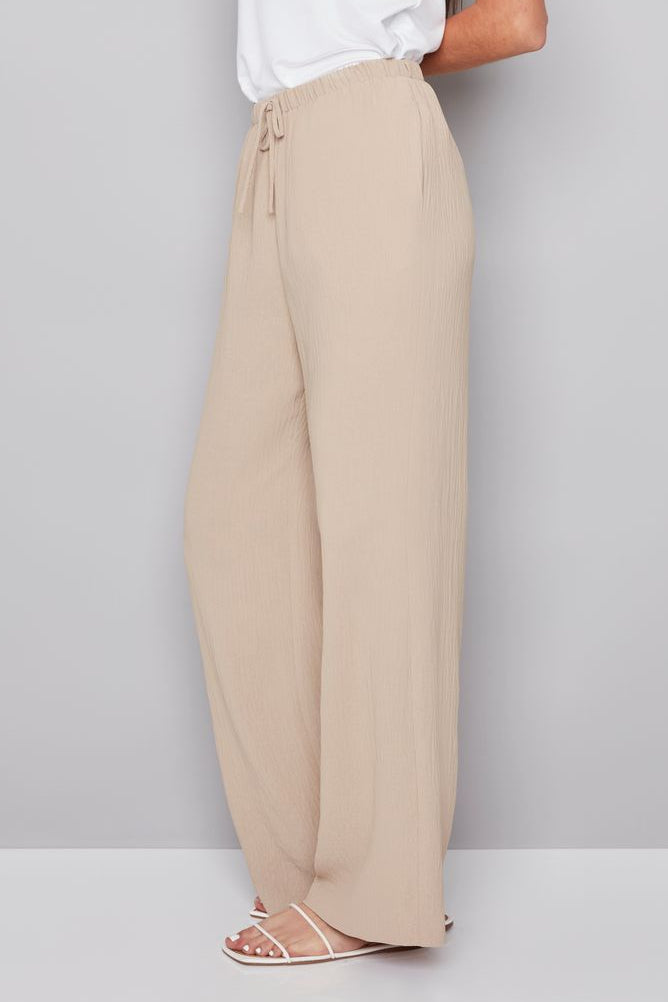 woman wearing a beige drawstring pant