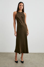  woman wearing a dark green satin dress