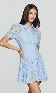 woman wearing a light blue short-sleeve lace mini dress with a collar and button-front design, front