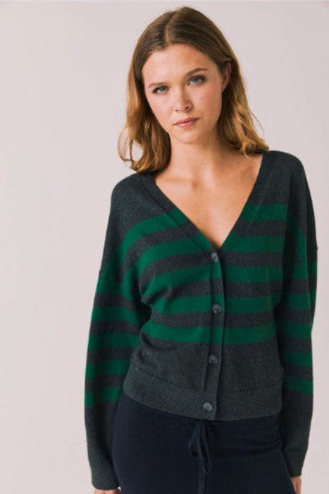 Woman wearing a green and gray striped cardigan