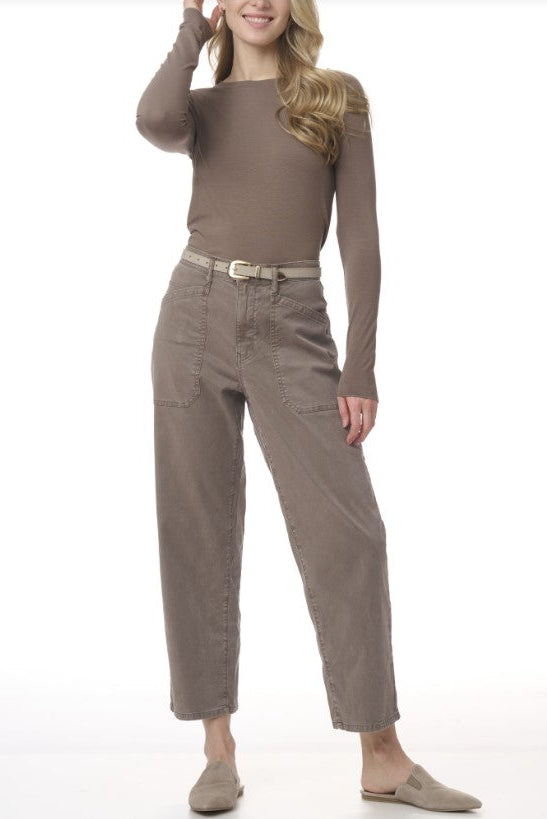 Woman wearing taupe pants. 