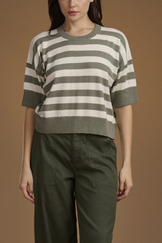 Women wearing a green and white striped sweater. 