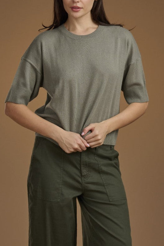 Person wearing a green sweater. 