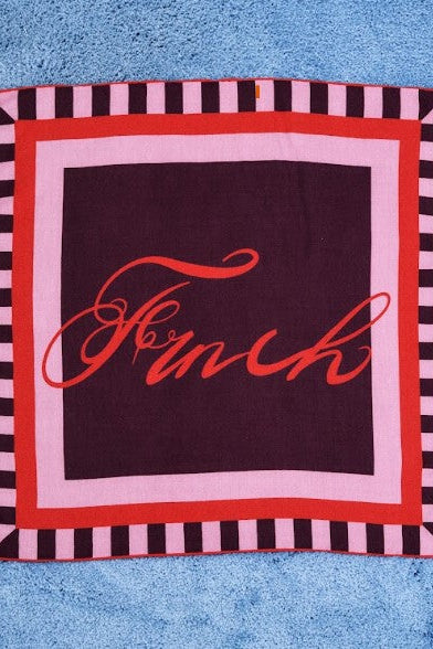 A square scarf featuring a dark plum center with the word 'French' in red cursive, surrounded by pink and red borders and a black-and-pink striped outer border. 