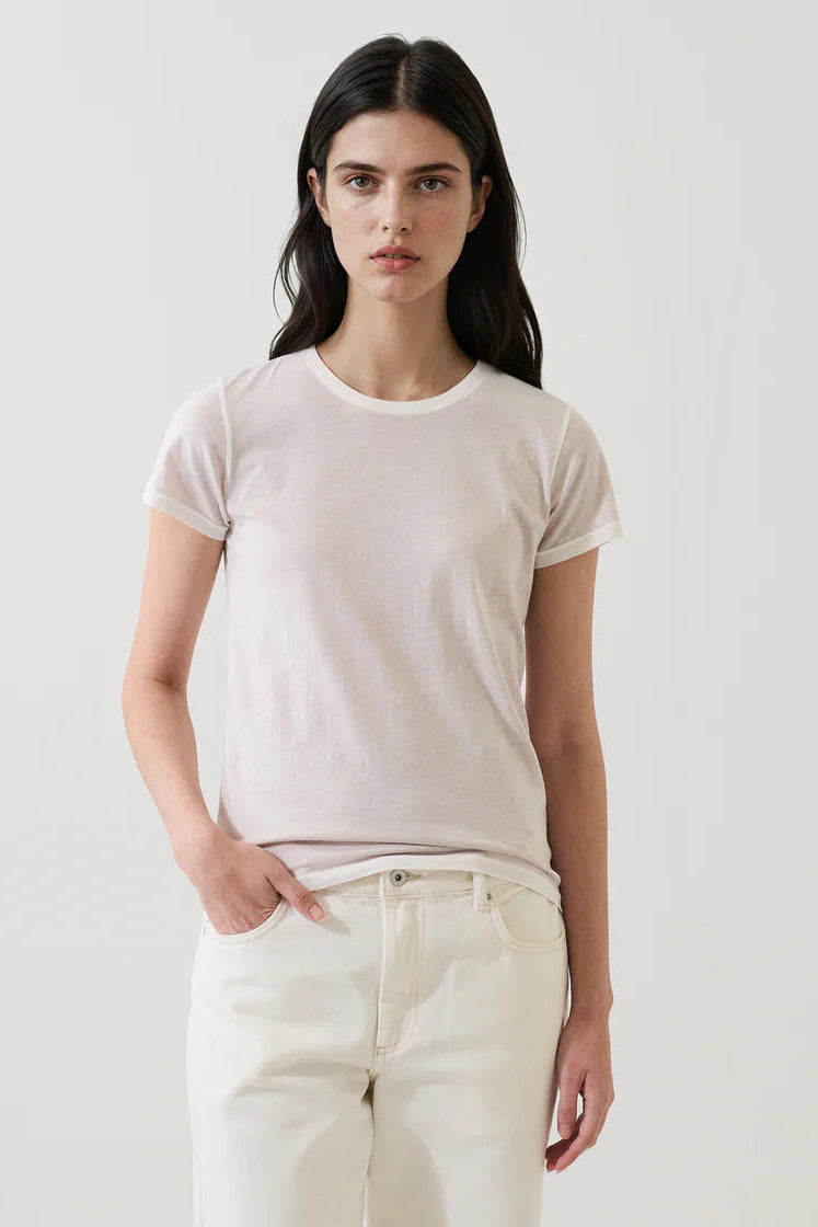 woman wearing a eggshell white tee shirt