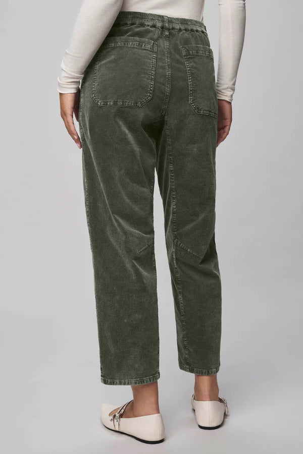 Person wearing green corduroy pants 