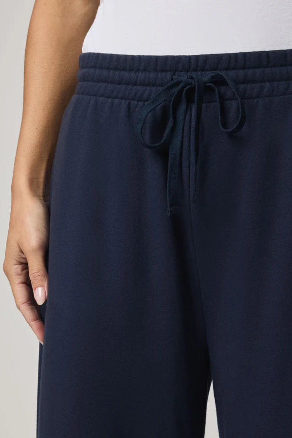 close up of a navy ankle length wide leg pant