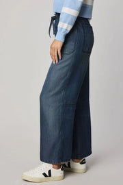 woman wearing an ankle length blue tencel denim wide leg pants