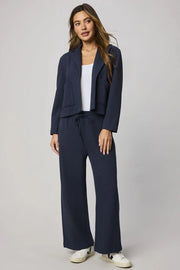 woman wearing a navy blue 100% cotton blazer 