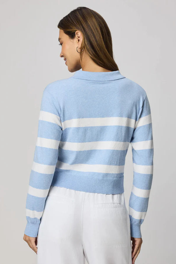 woman wearing a blue and white striped polo sweater
