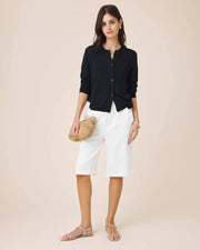Woman wearing a navy button up cardigan 