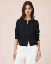 Woman wearing a navy button up cardigan 