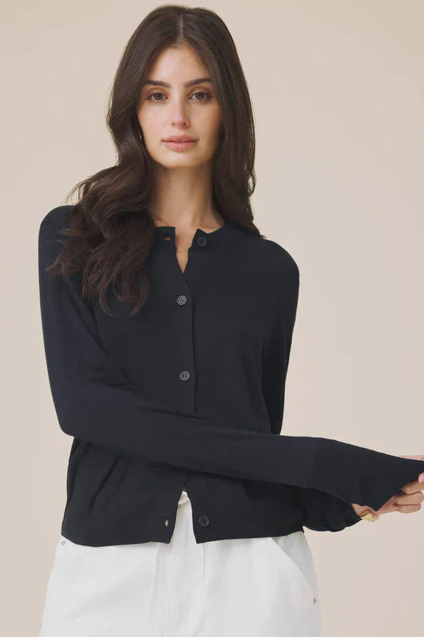 Woman wearing a navy button up cardigan 
