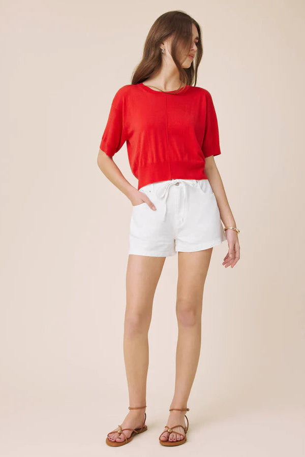 Woman wearing a red light weight tee 