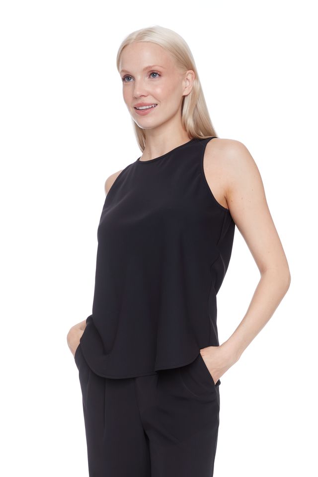 Side view of woman wearing a black satin sleeveless top 