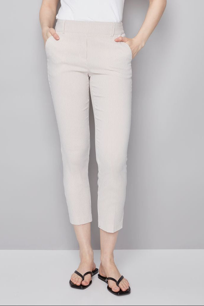 woman wearing an ankle length beige stripped pants