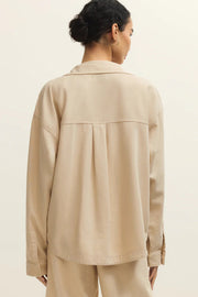 back view of light beige twill collared button up jacket