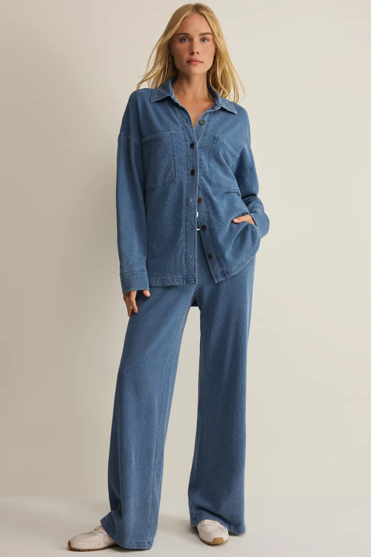 woman wearing blue wide leg lounge pants with a drawstring waist and relaxed fit, front