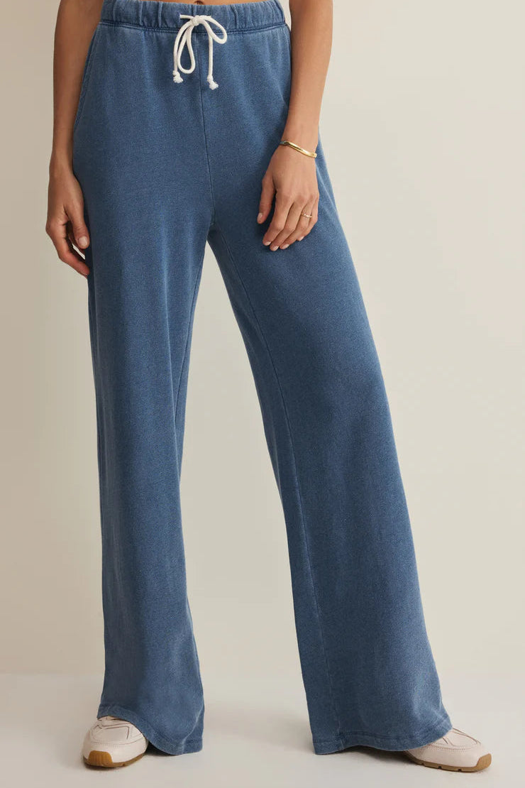woman wearing blue wide leg lounge pants with a drawstring waist and relaxed fit, front