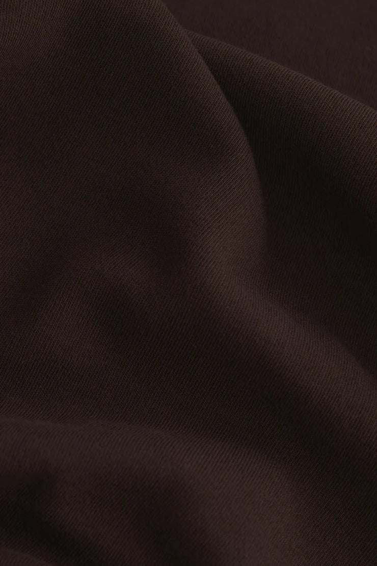 Close-up of dark brown fabric texture