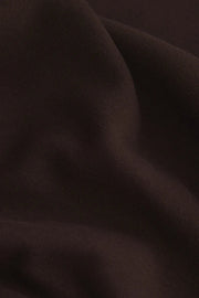 Close-up of dark brown fabric texture