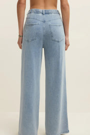 light blue wide leg denim pants with elastic waistband and front pockets, back view
