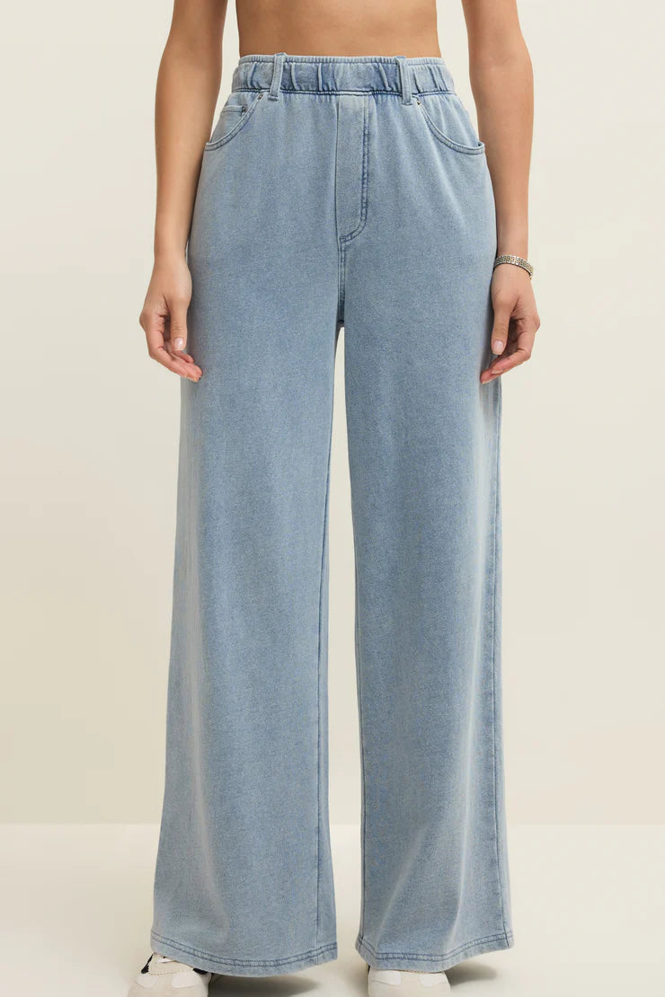 light blue wide leg denim pants with elastic waistband and front pockets, front view