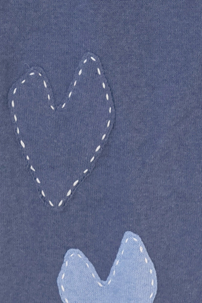 Blue scarf with imperfect heart patches and whipstitch detailing all over