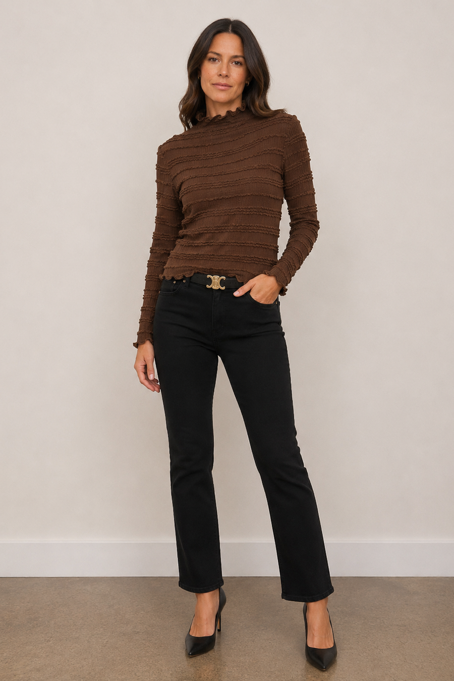 A woman modeling a brown ribbed mock-neck long-sleeve top 