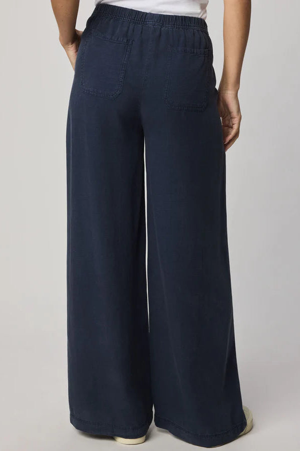 Navy wide-leg pull-on pants with an elastic waistband, back view