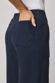 Navy wide-leg pull-on pants with an elastic waistband, back pocket detail