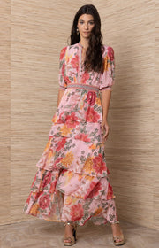 Woman wearing a floral dress.