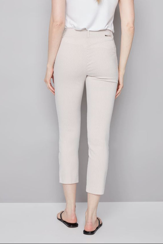 woman wearing an ankle length beige stripped pants