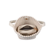 Cream woven shoulder bag with a structured bucket silhouette, open basket weave texture, and slim shoulder strap, top down