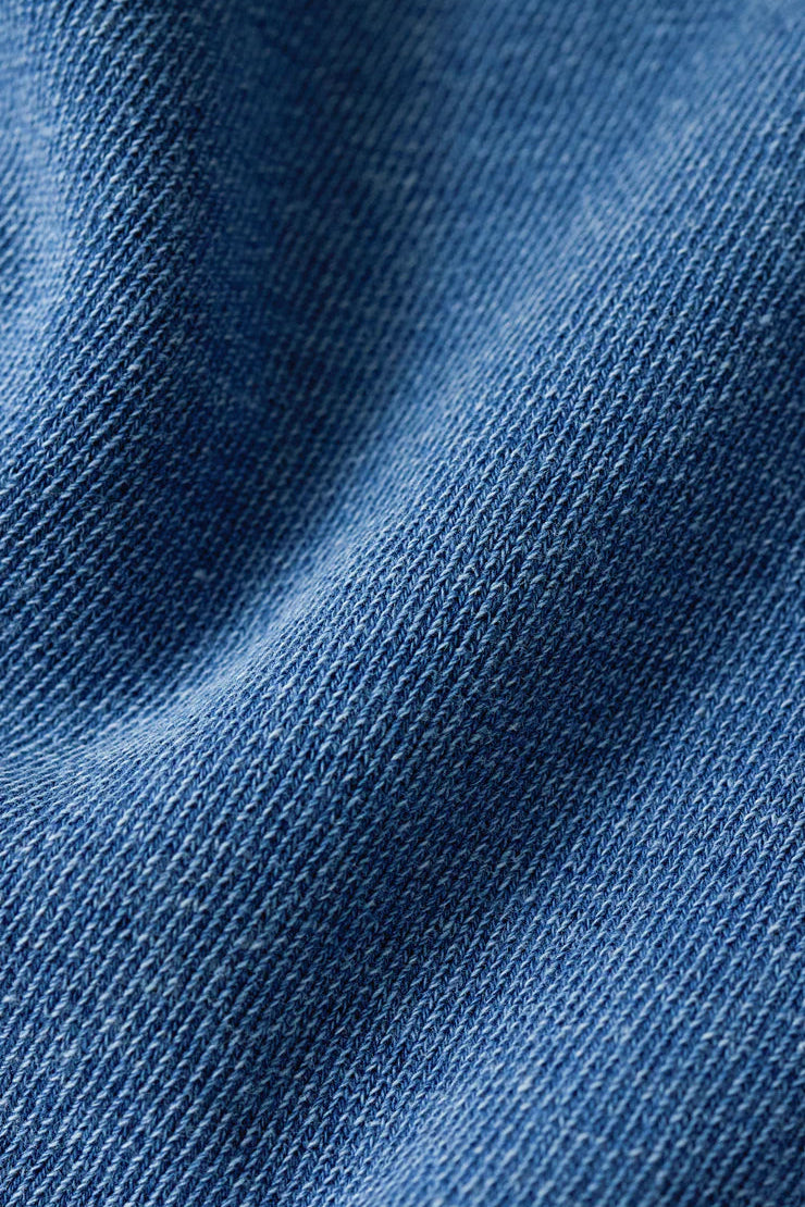 blue long-sleeve button-front cardigan with a relaxed fit, fabric detail