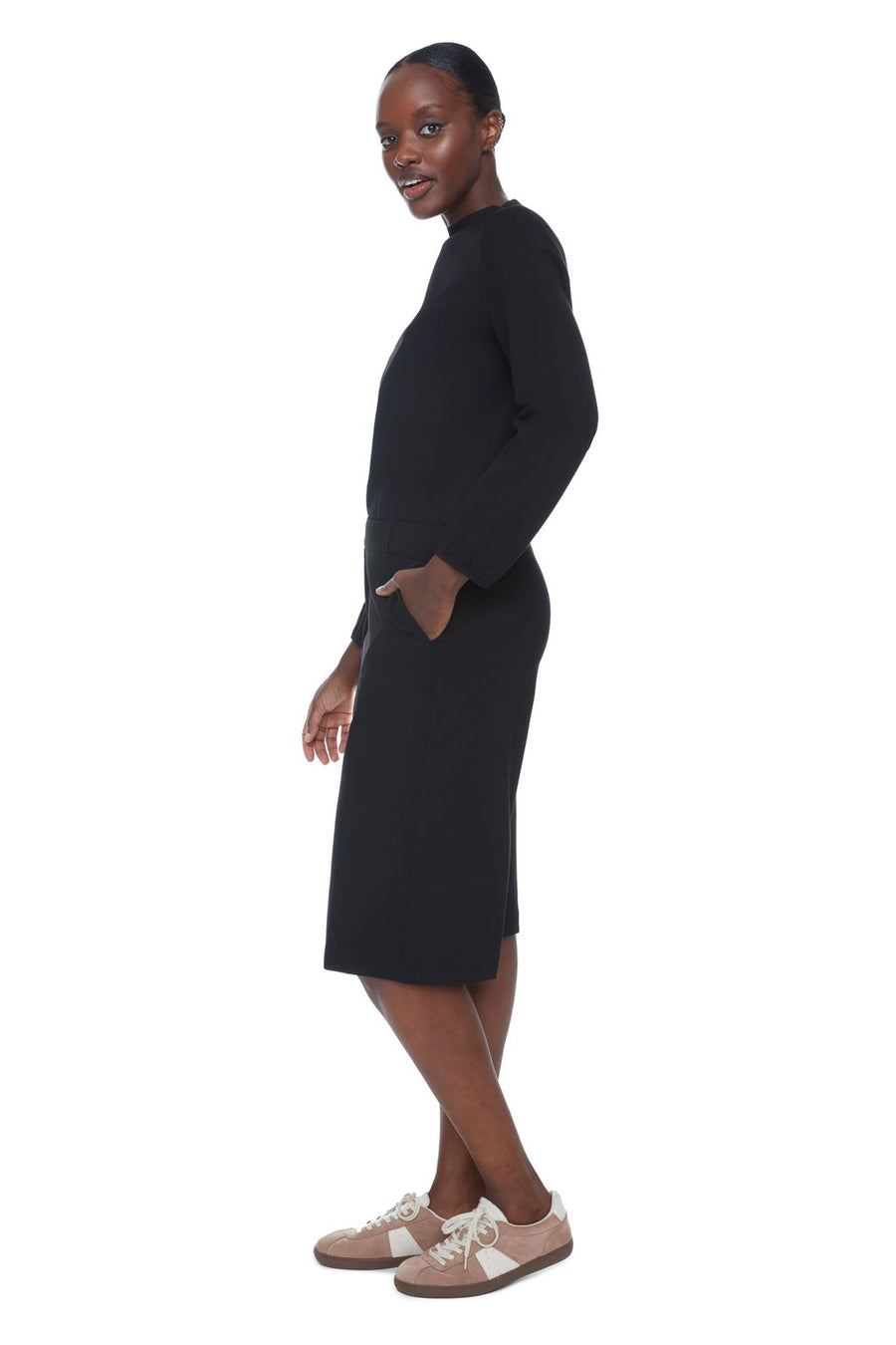 Women wearing long black wide-leg shorts 