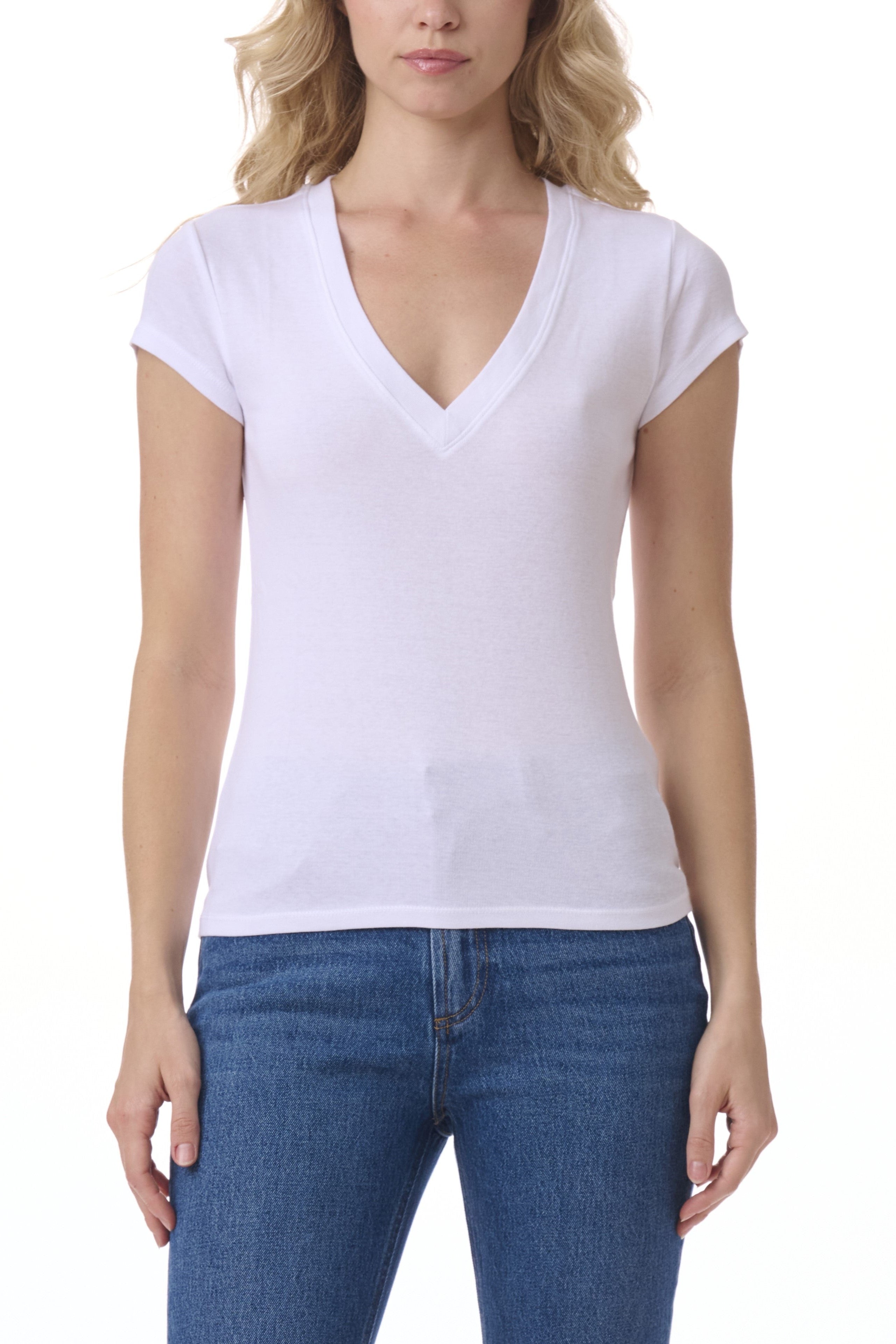 Woman wearing a plain white t-shirt and blue jeans on a white background