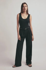 woman wearing a black belt with a silver coloured buckle